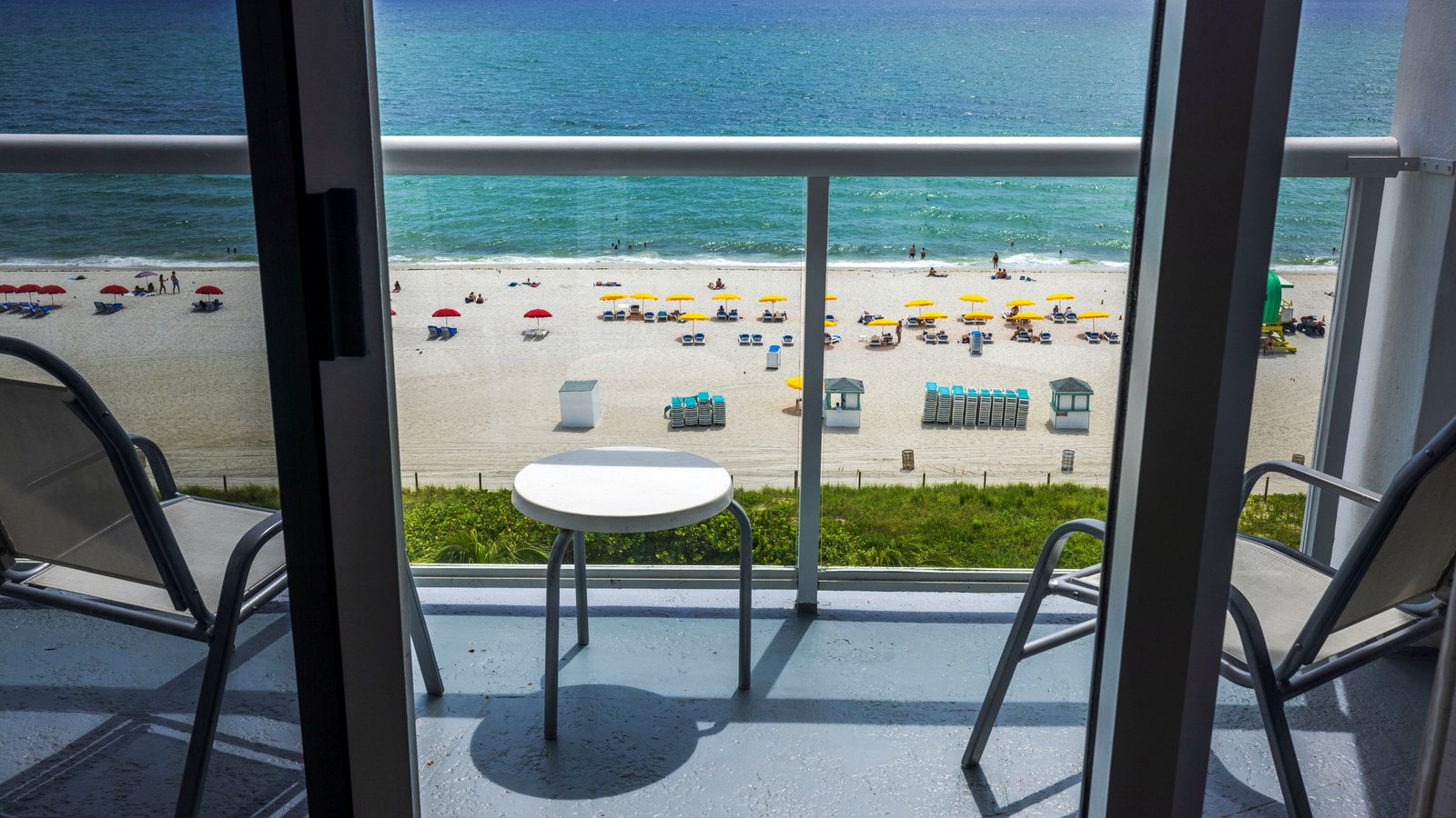 View from a condo balcony over the beach — condo vs hotel for PCB spring break