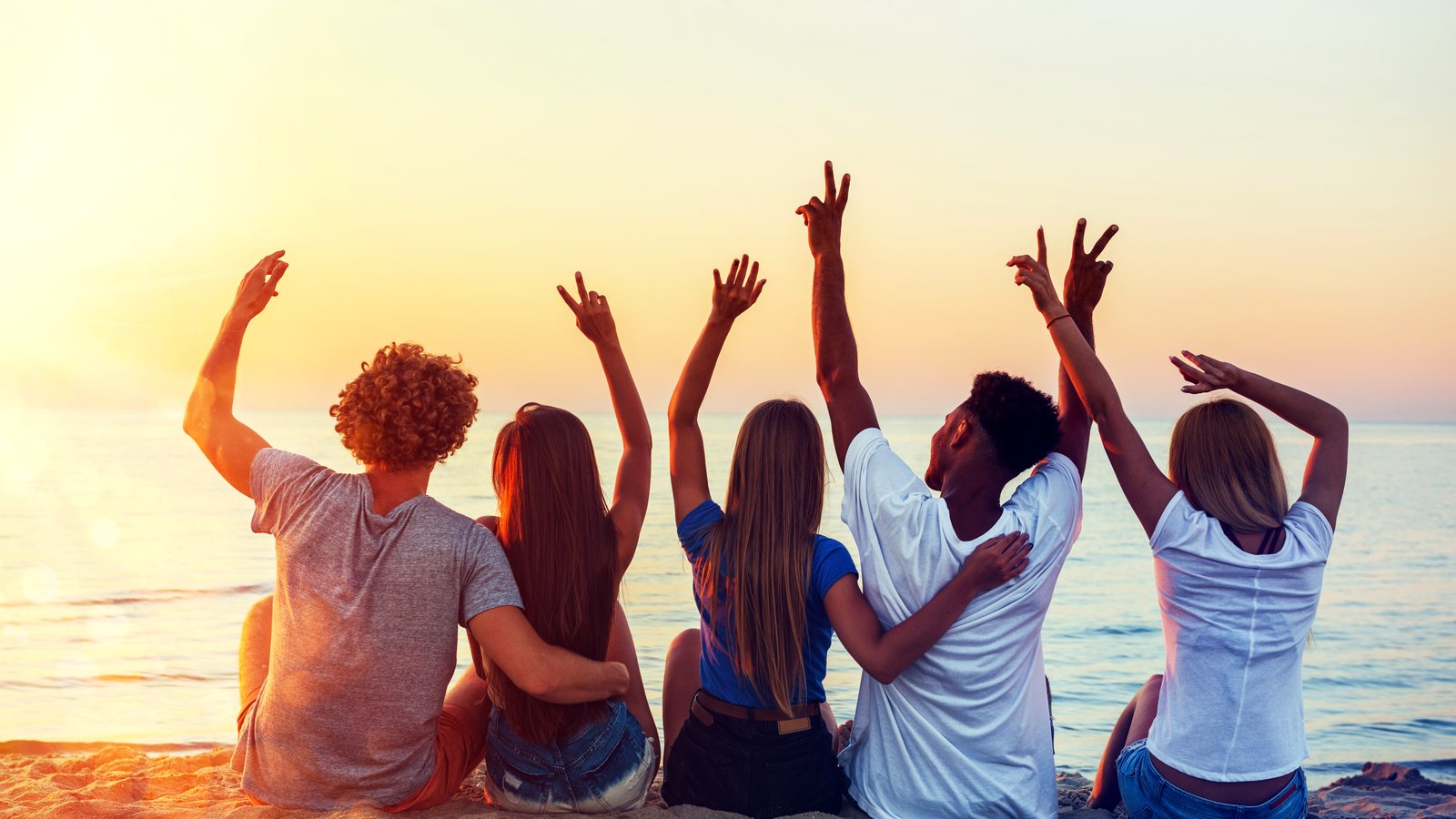 Friends on the beach at dawn