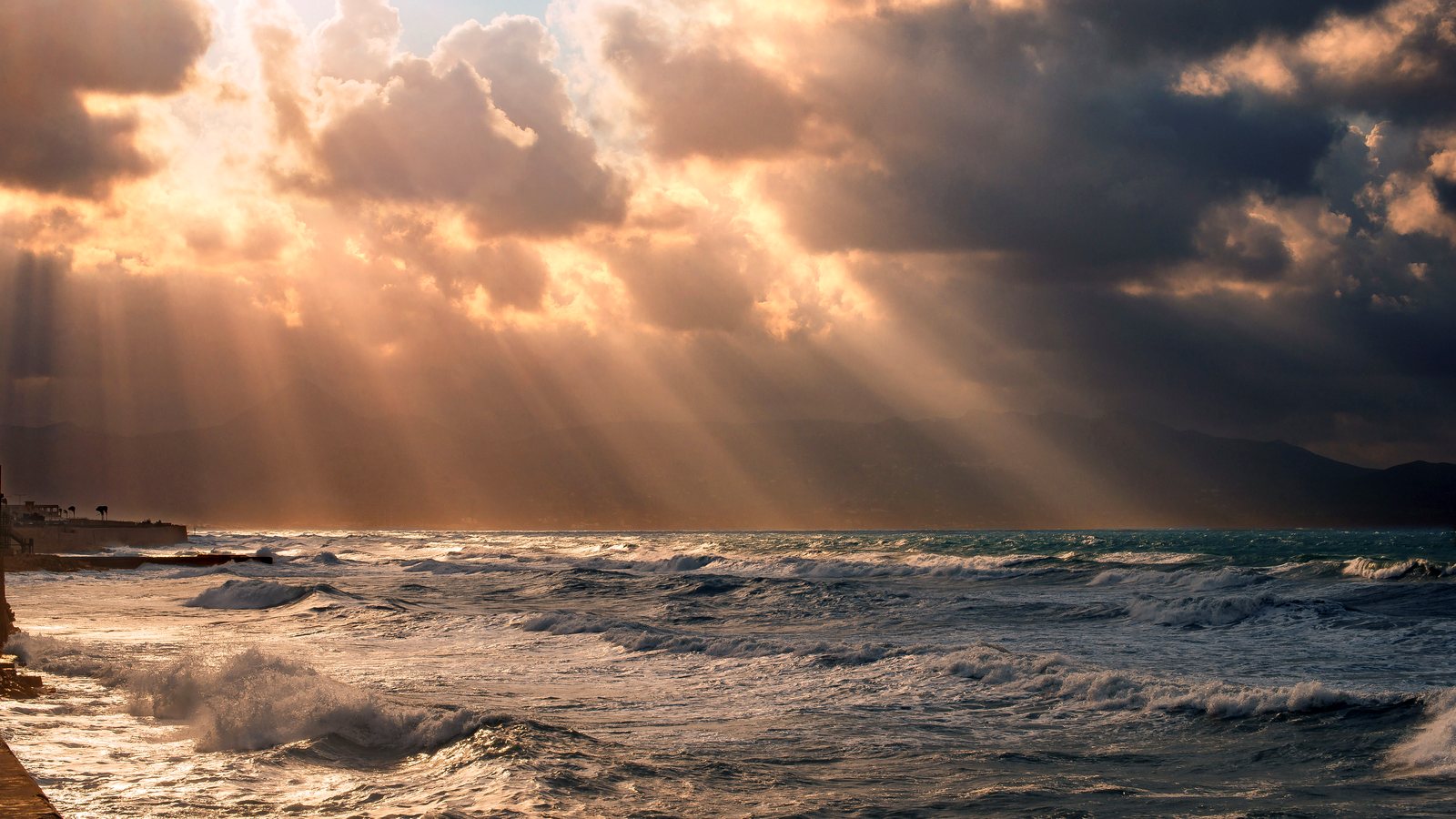Rays of light through clouds over the sea