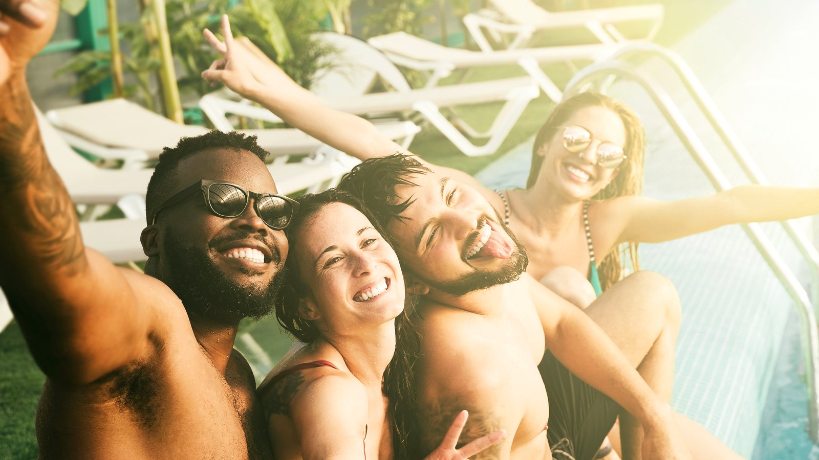 Friends at a pool party at a vacation rental
