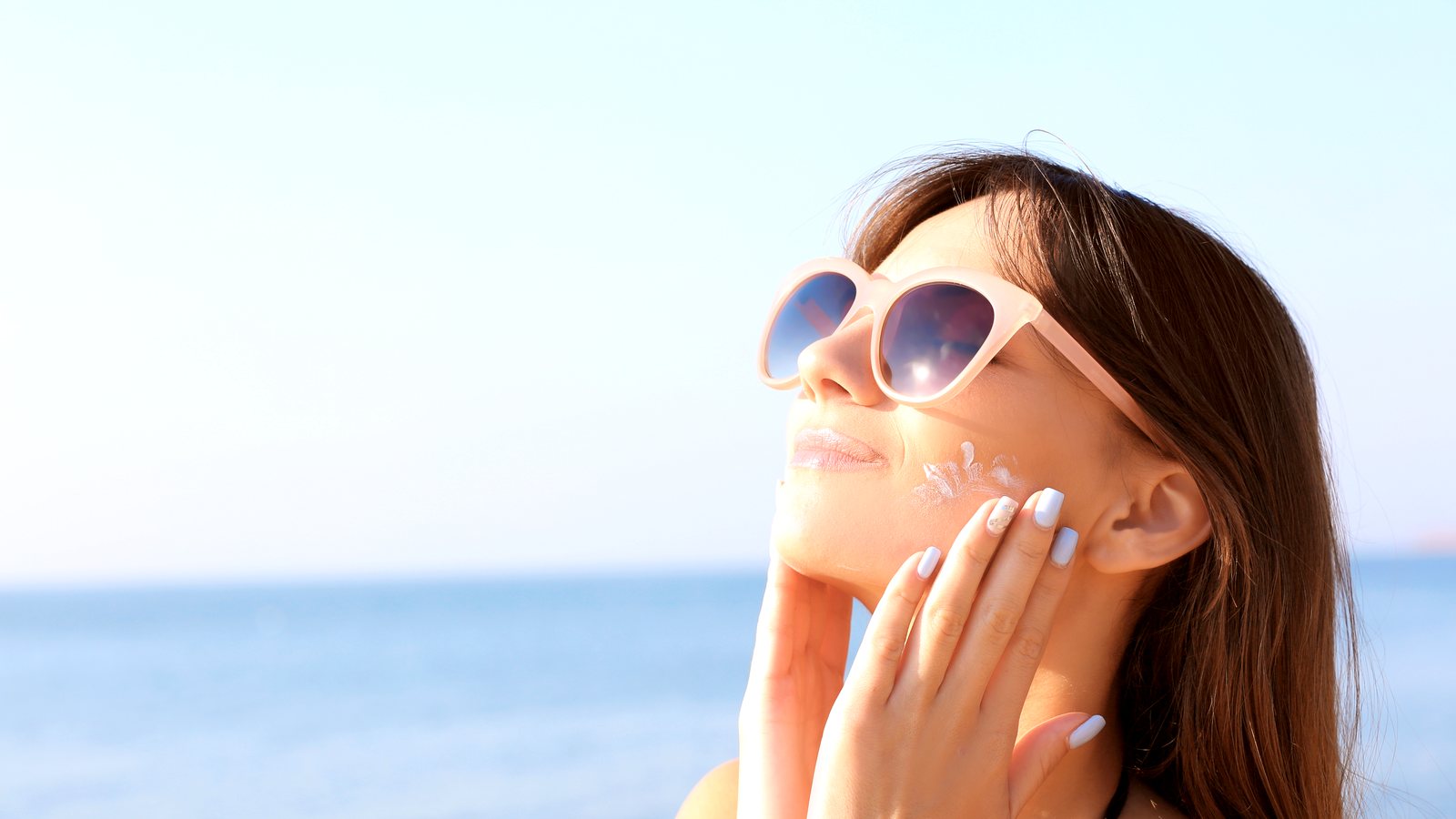 Applying sunscreen at the beach